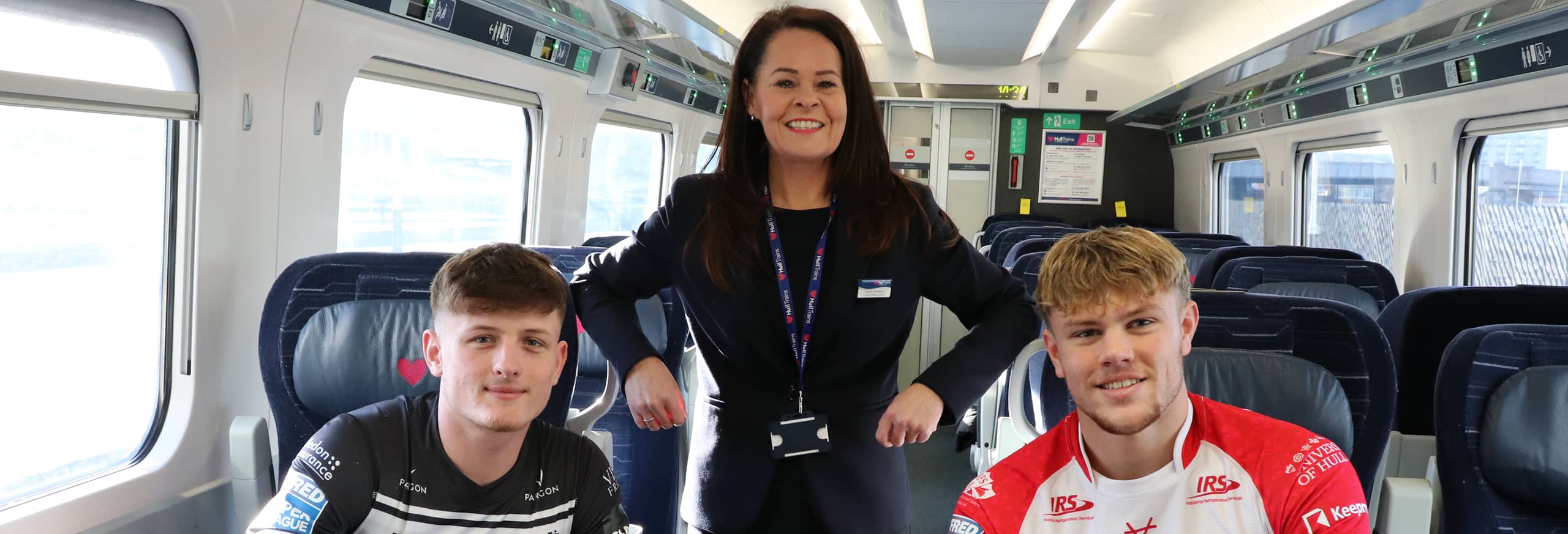 Hull KR and Hull FC players onboard a Hull Trains service