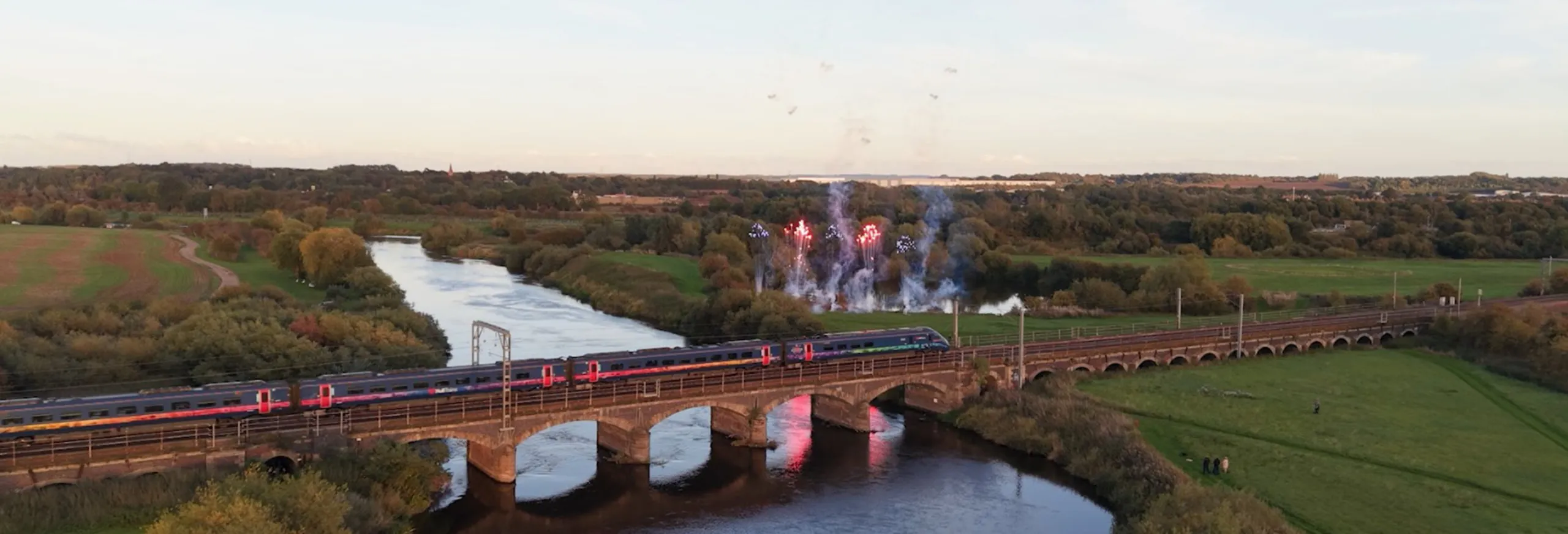 Hull Trains passing over a bridge with fireworks