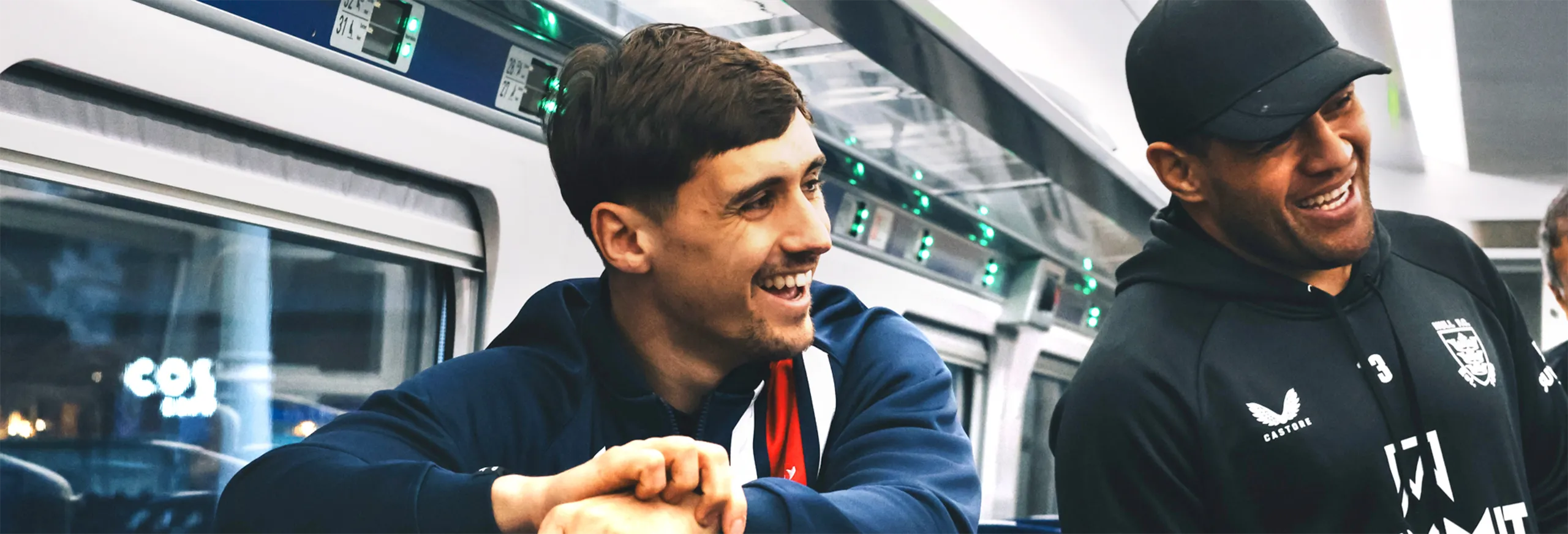 Hull KR and Hull FC players onboard a Hull Trains service