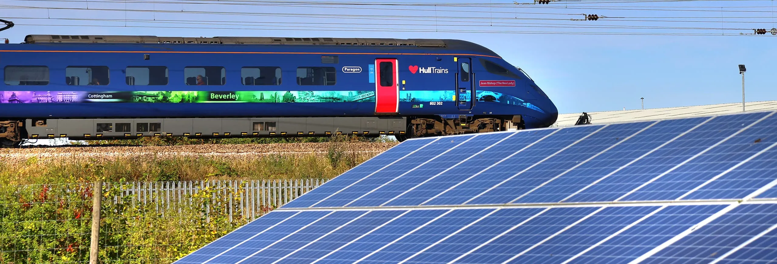 Hull Trains service passing through a field of solar panels