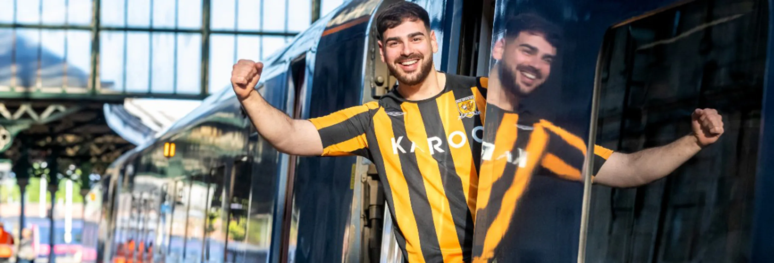 A Hull City fan on a Hull Trains service