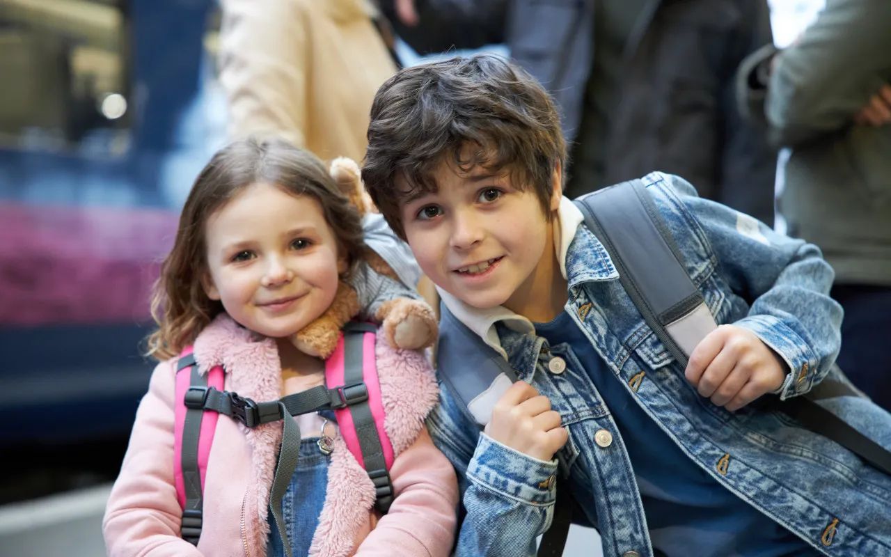 boy and girl outside train hull paragon station