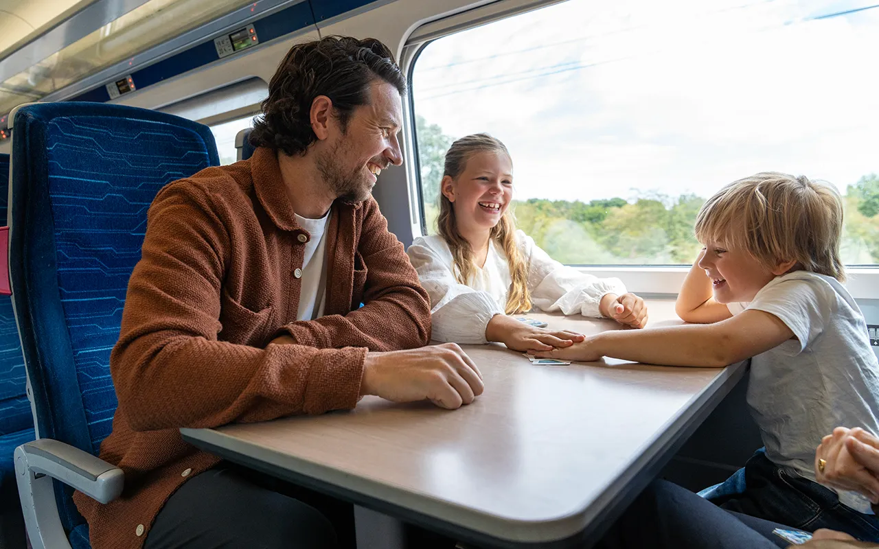 Family sitting around a table onboard a Hull Trains service