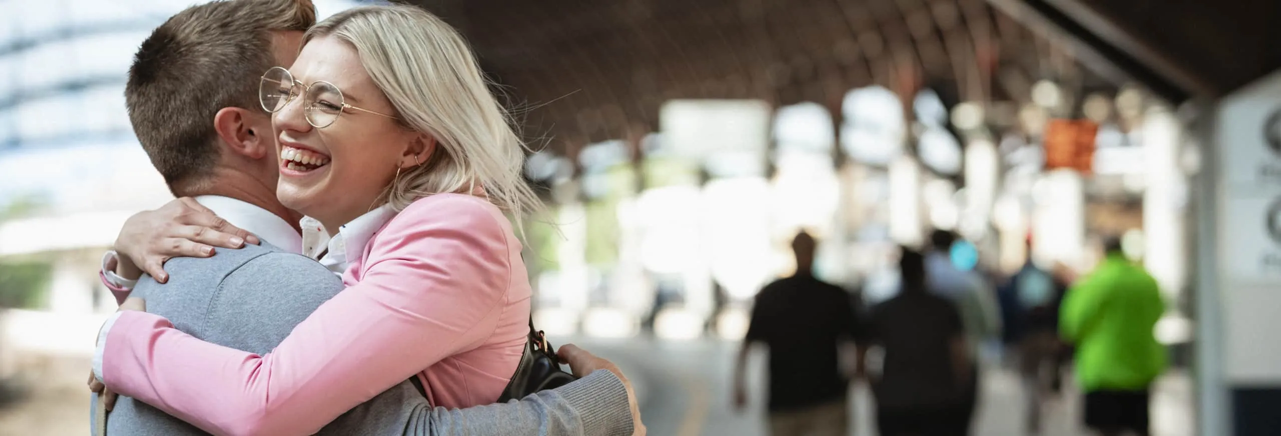 Two people hugging each other
