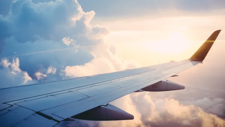 Airplane wing in the clouds