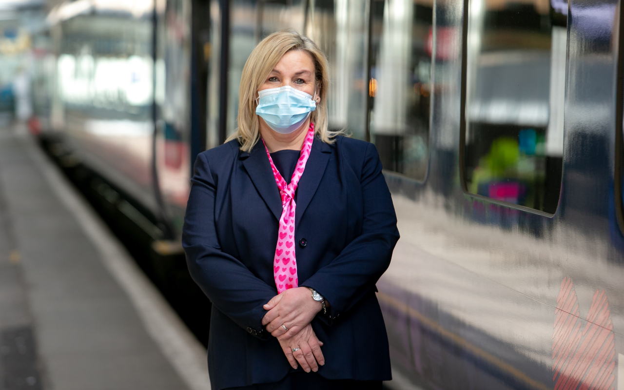 Hull Trains on board team member wearing a mask